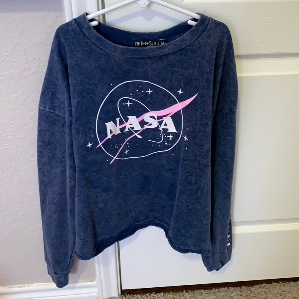A blue crop top with NASA symbol